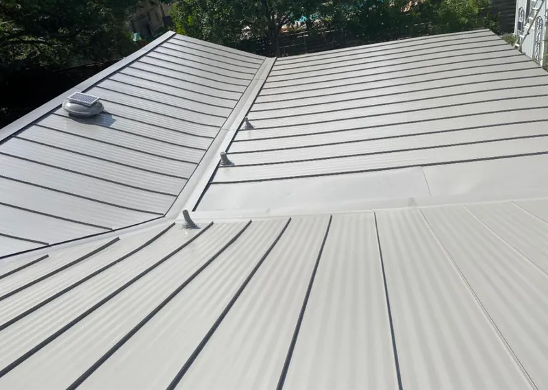 Solar attic fan installed on a metal roof for Roof Ventilation in Foothill Farms